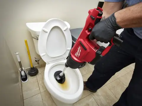 Speed Drain unblocking a toilet with a drain machine